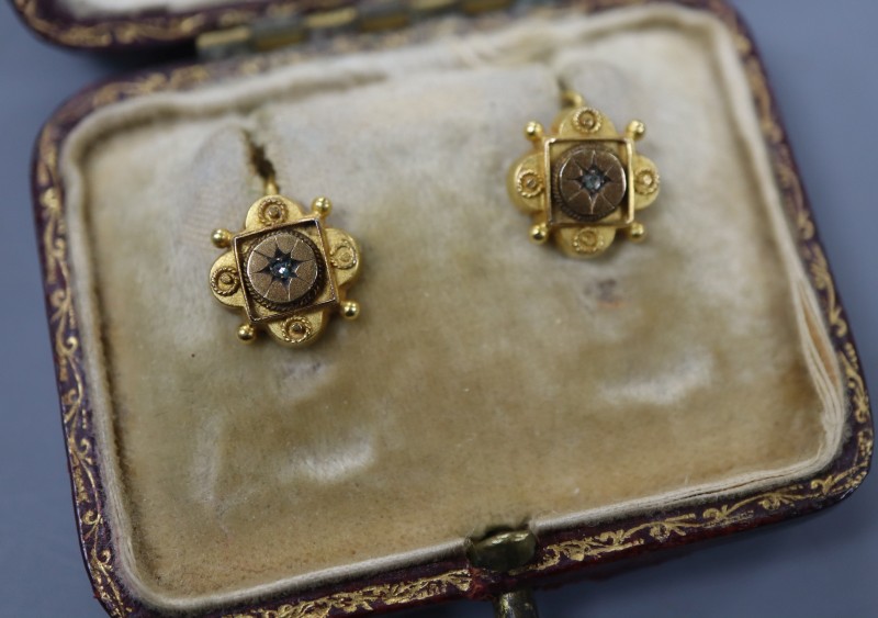 A pair of Victorian yellow metal and diamond chip set quatrefoil shaped earrings, 9mm, gross 1.3 grams.